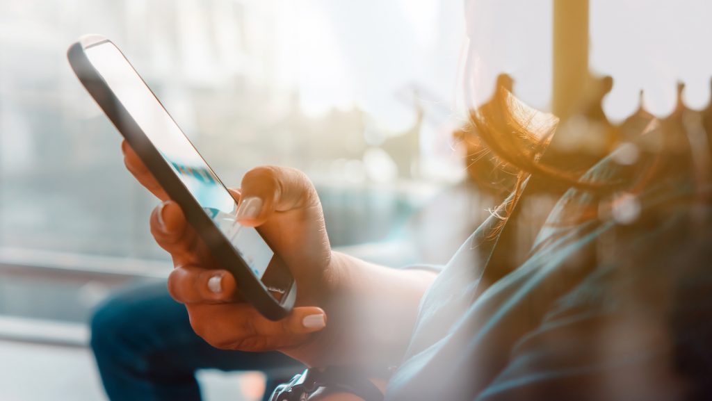 closeup image of women hand holding a smartphone