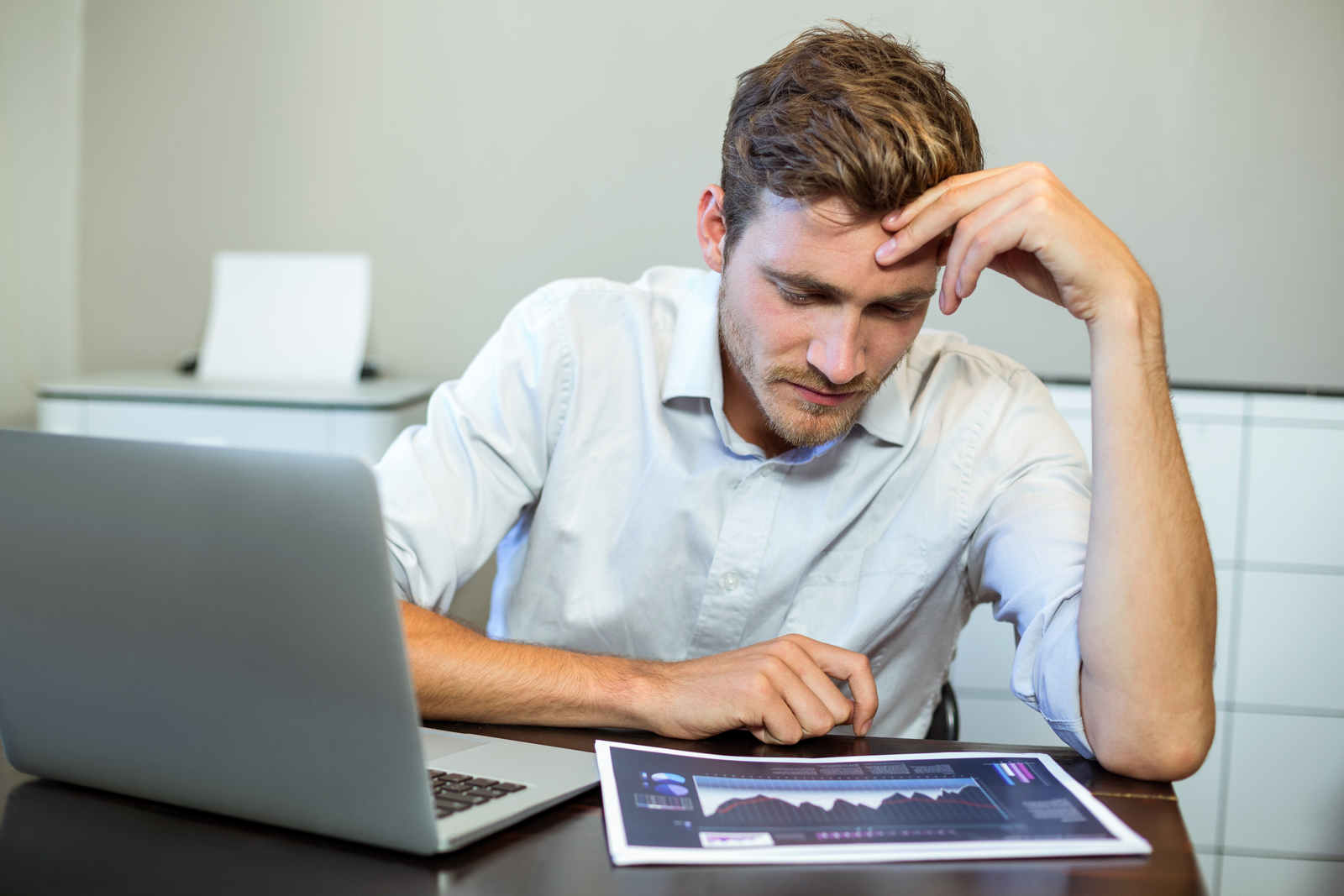 frustrated businessman sitting in office