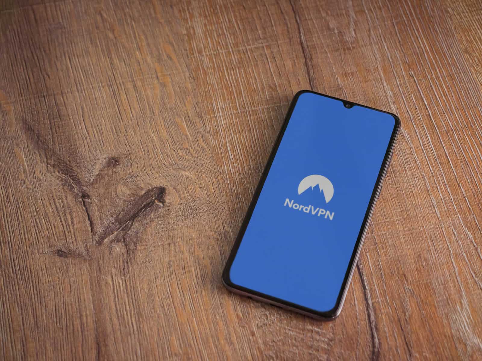 nordvpn app launch screen with logo on the display of a black mo